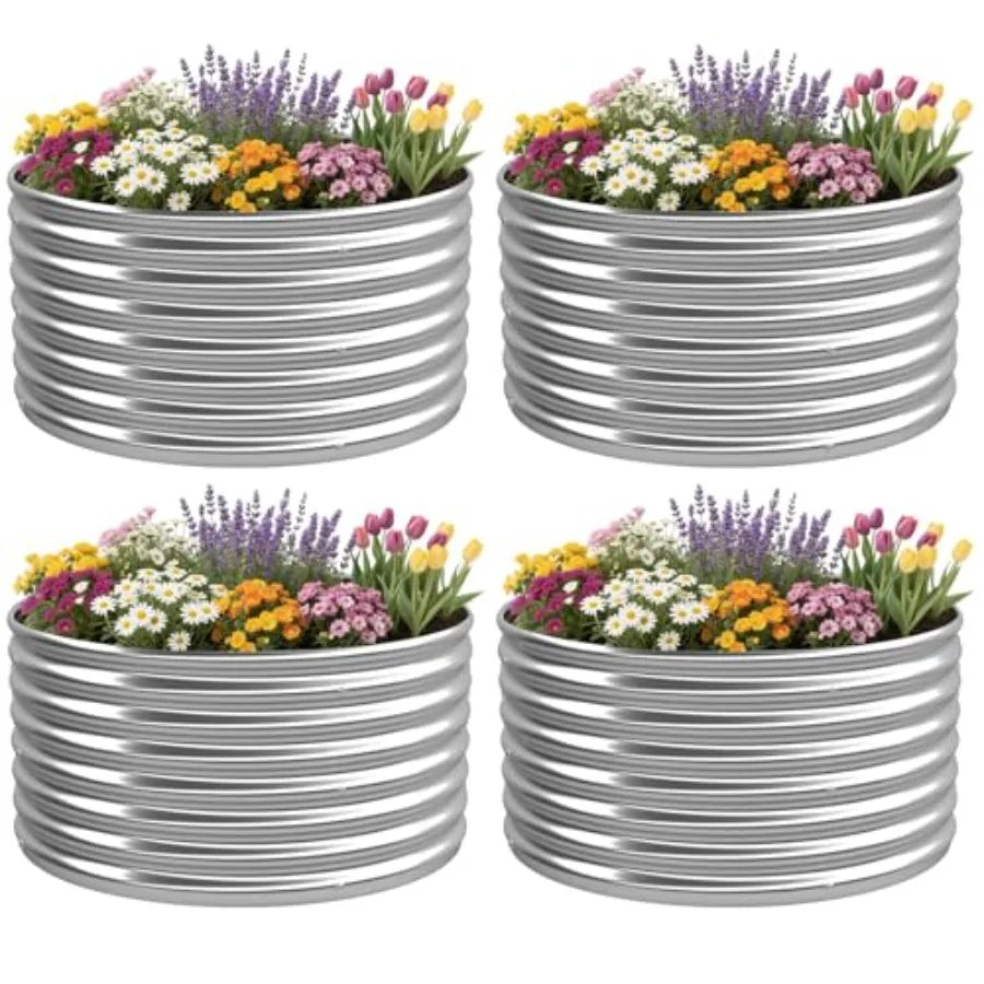 Four metal planters with flowers on a white background