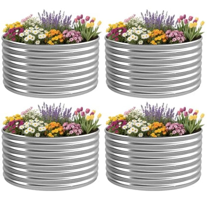 Four metal planters with flowers on a white background